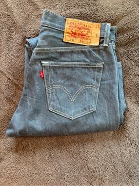 Levi's 501 Straight Leg Button Fly Jeans Light Blue with Red Tab.
Size 34-32